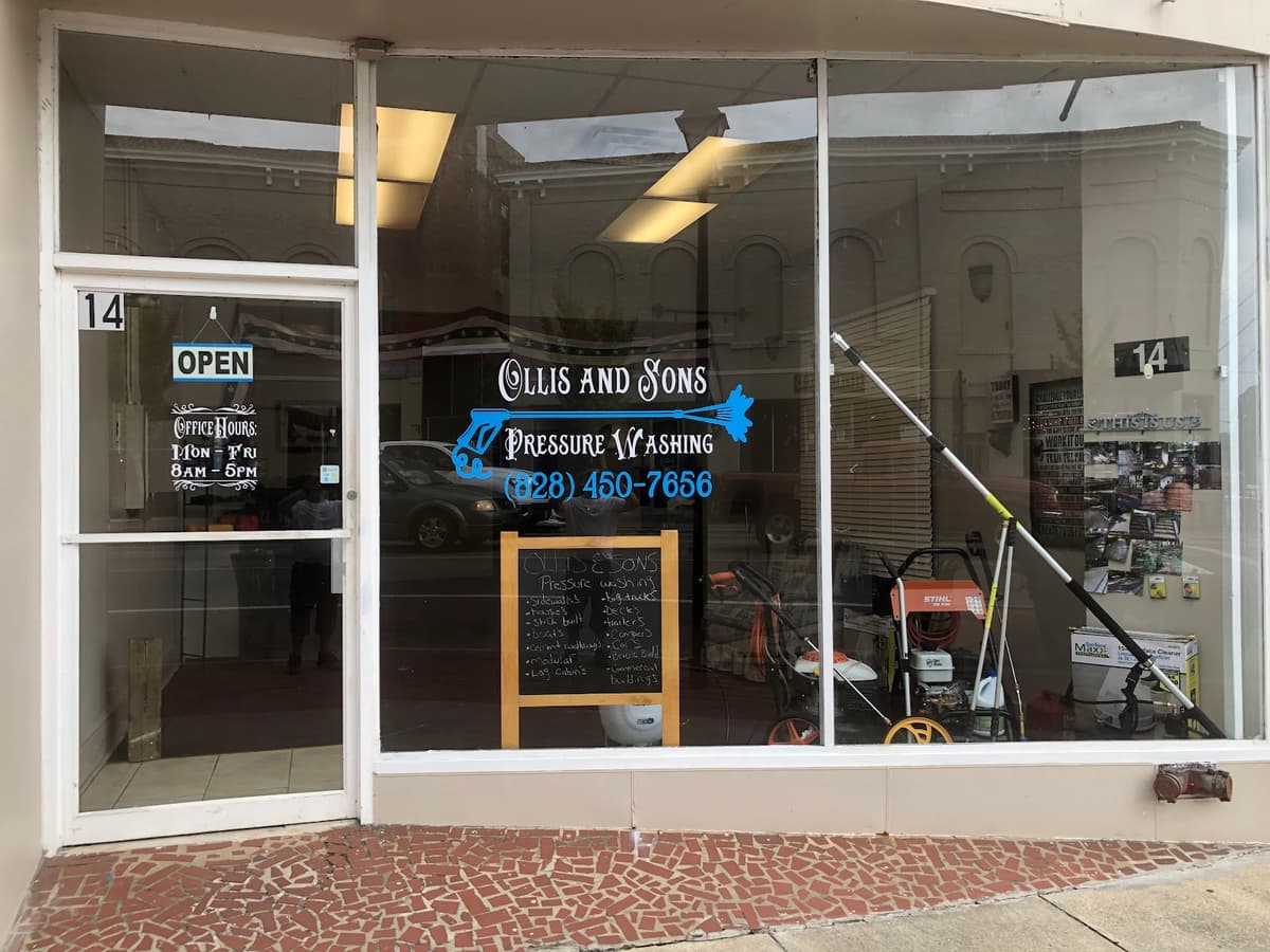 Ollis and Sons Pressure Washing storefront window signage and equipment